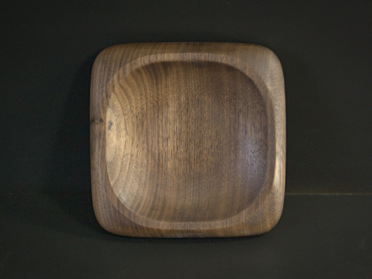 Small square wooden tray with rounded edges top view