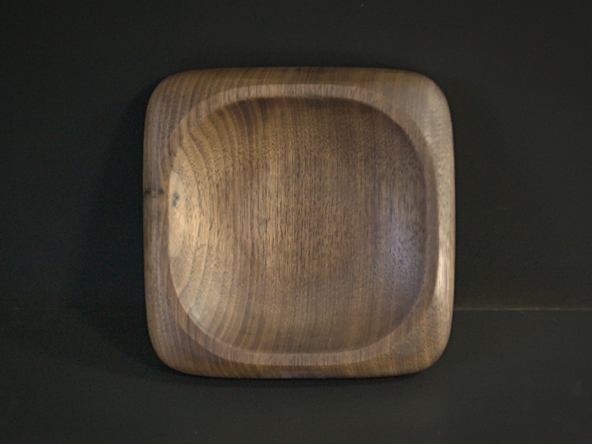 Small square wooden tray with rounded edges top view