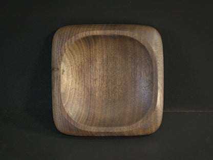 Small square wooden tray with rounded edges top view