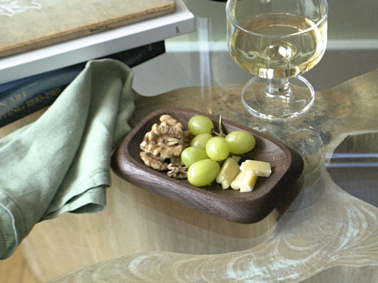 Small wooden tray holding snacks