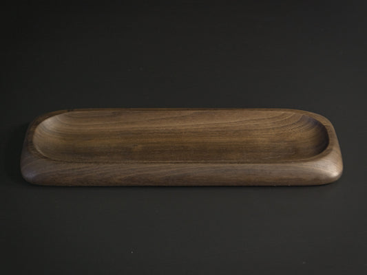 Long thin wooden tray called Nibble Board